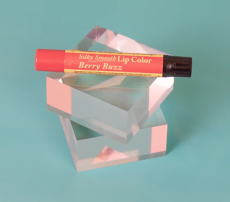 The Naked Bee Berry Buzz Silky Smooth Lip Color tube on white background