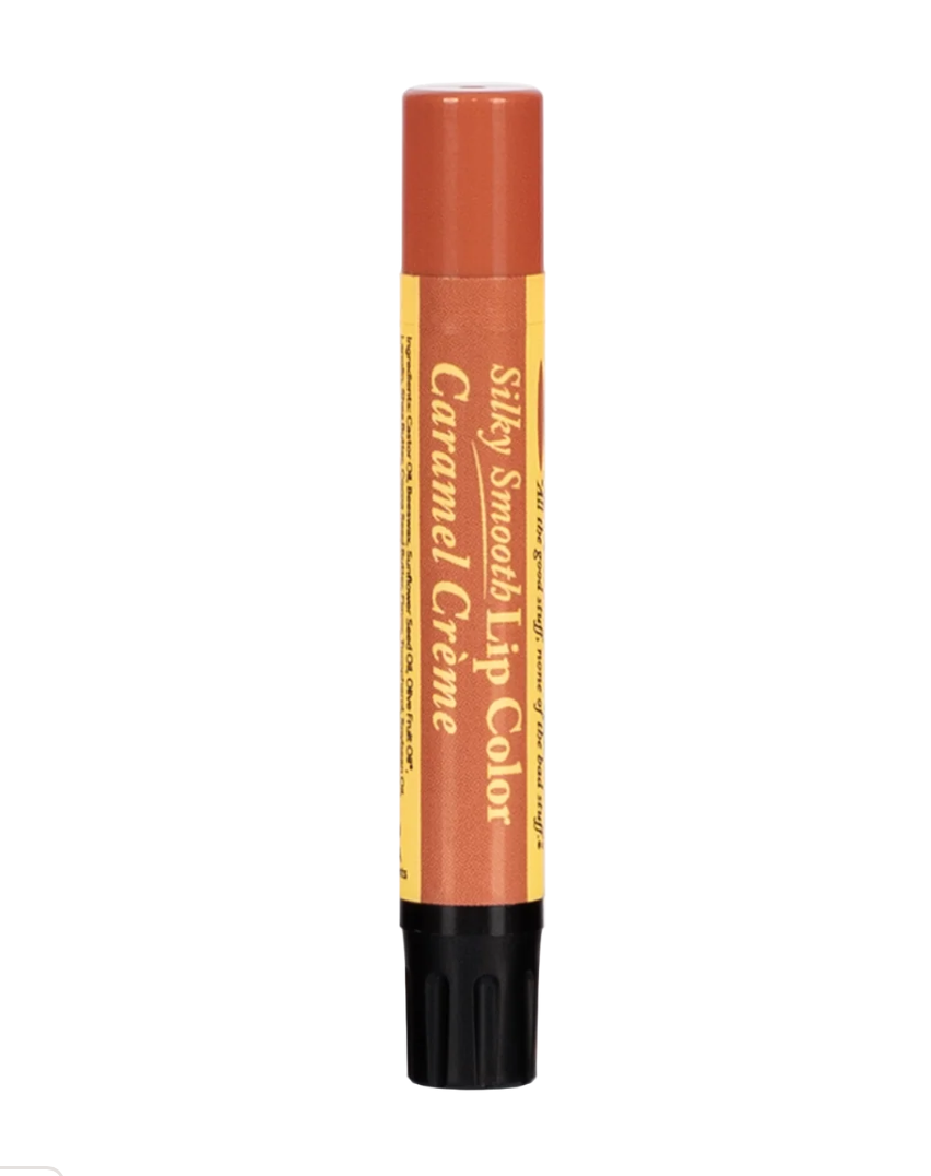 The Naked Bee Caramel Crème Silky Smooth Lip Color on teal background