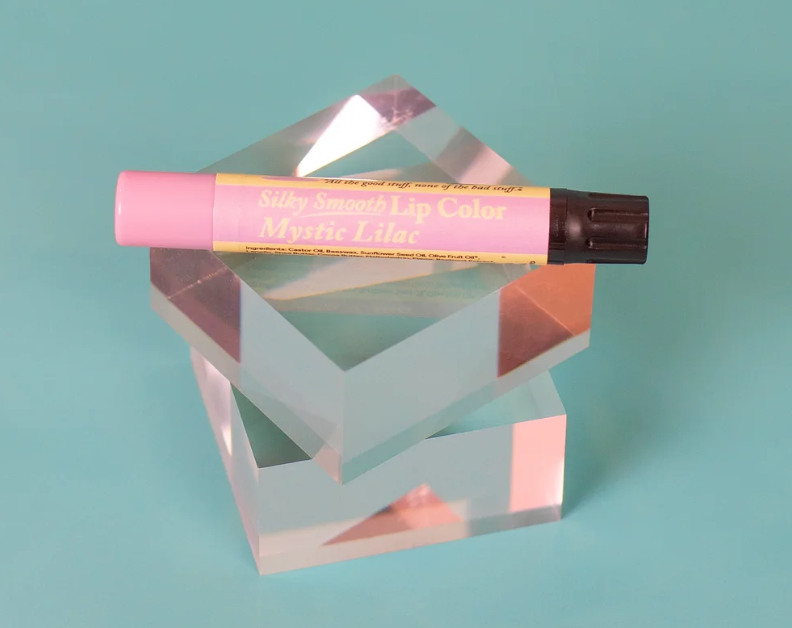 The Naked Bee Mystic Lilac Silky Smooth Lip Color tube on white background