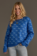 Model wearing a blue ho ho ho pattern sweater, front view